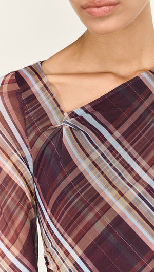 Close-up of the Plaid Mesh Long Sleeve Midi Dress showcasing its unique plaid pattern and refined neckline.