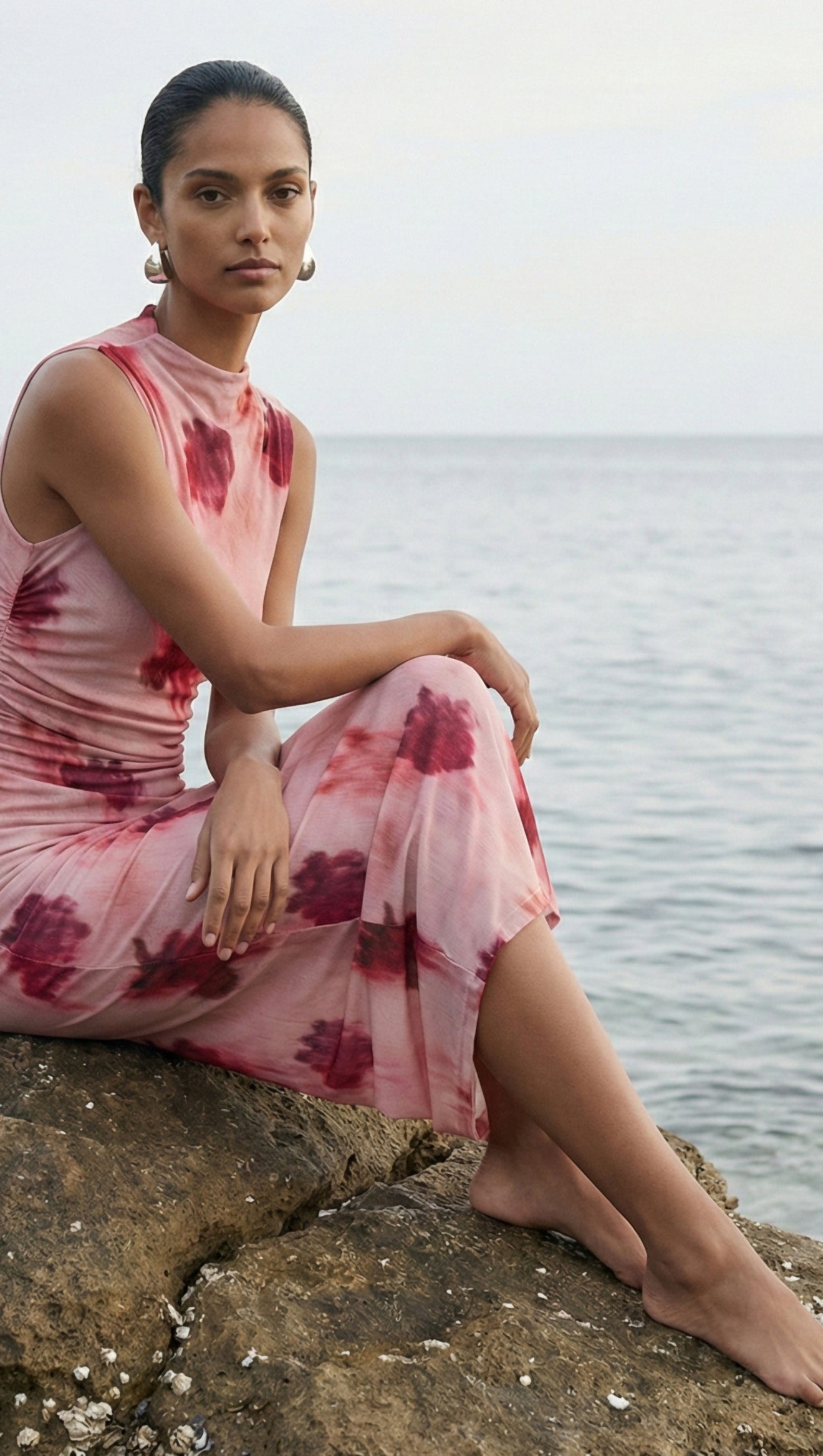 Pink Floral Sleeveless Mesh Midi Dress displayed on a model standing against a plain background.
