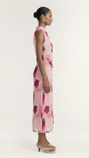 Side view of a model wearing a Pink Floral Sleeveless Mesh Midi Dress, showing floral patterns and sleek design.