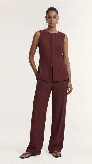 Model wearing a Burgundy Round Neck Textured Vest paired with matching pants, demonstrating modern tailored style.