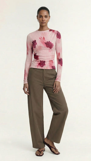 Pink Floral Mesh Long Sleeve Top worn with loose brown pants, showcasing a stylish and modern outfit.