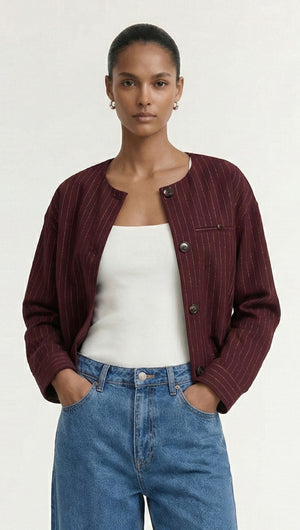 Burgundy Pinstripe Cropped Jacket worn by model, showcasing modern tailoring and refined style.