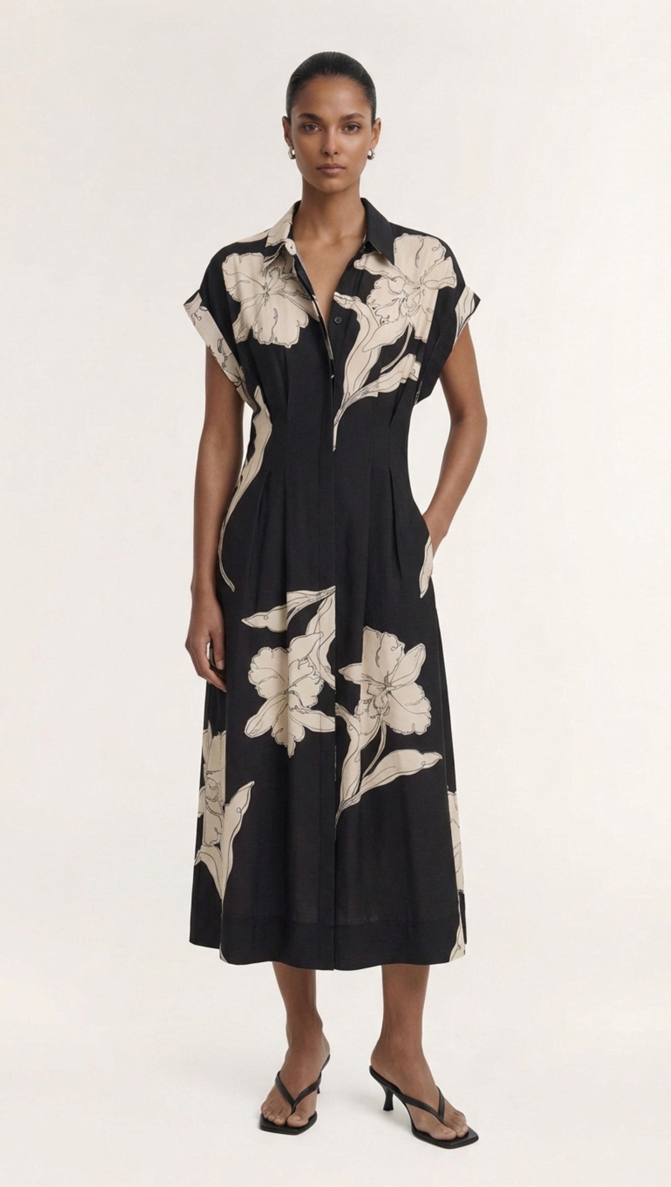 Cream Floral Midi Shirt Dress featuring a model wearing a black dress with floral print, perfect for casual or formal occasions.
