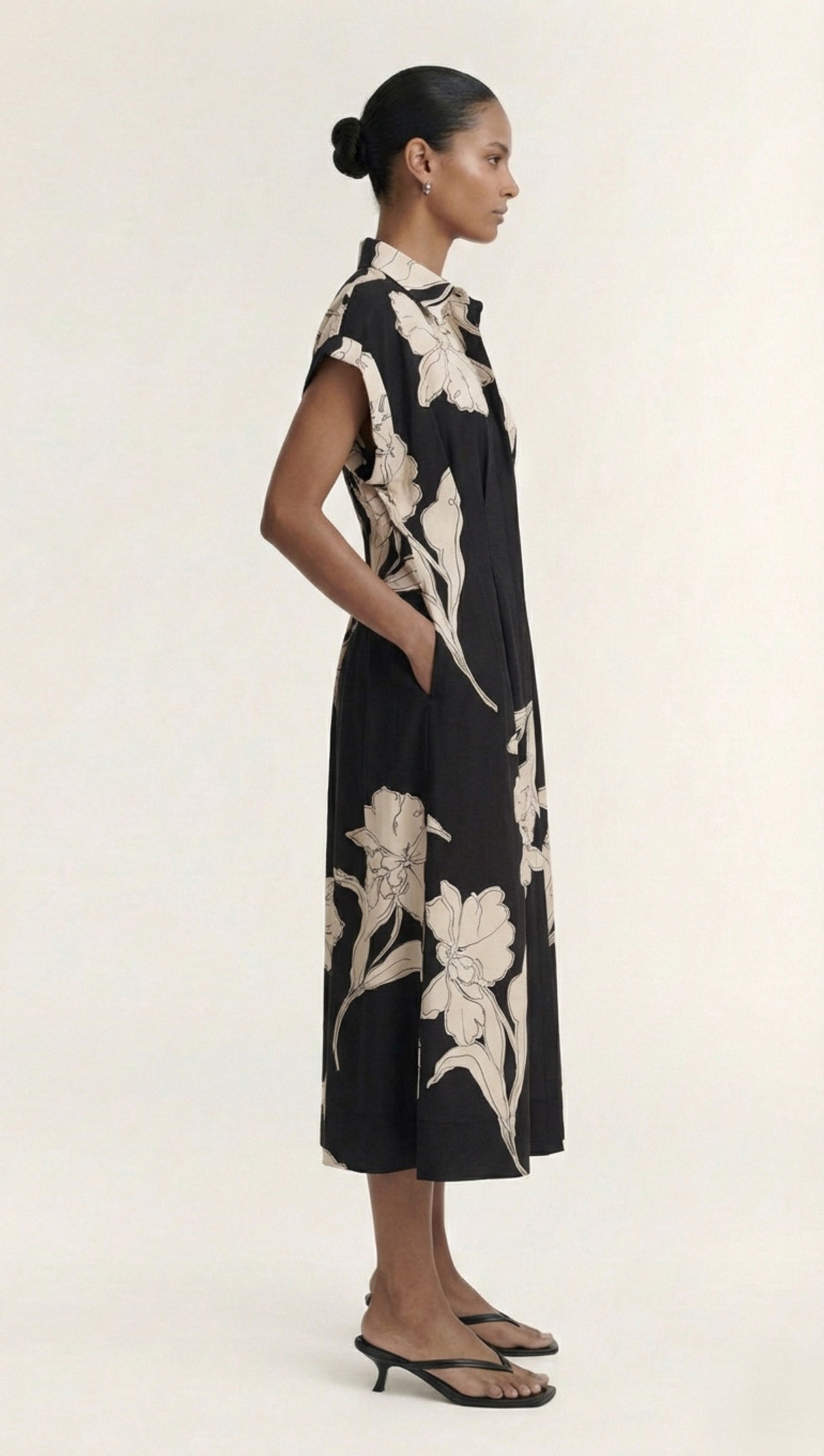 Cream Floral Midi Shirt Dress featuring a model wearing a black dress with floral print, perfect for casual or formal occasions.