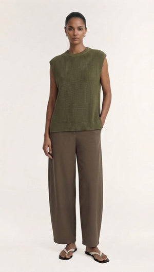 Model wearing a Khaki Cotton Blend Knit Tank Top paired with stylish trousers.