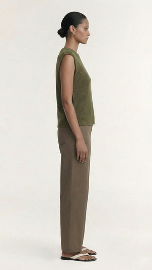 Khaki Cotton Blend Knit Tank Top displayed on a model in profile view, paired with beige trousers.