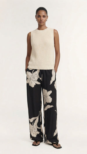 Model wearing Sketched Floral Drawstring Pant paired with a cream sleeveless top, showcasing an elegant floral design.