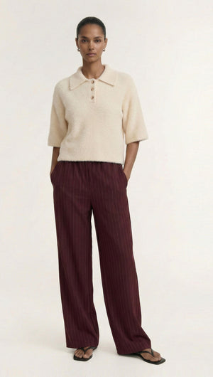 Fluffy Knit Polo Top in Cream styled with wide-leg burgundy pants for a chic and comfortable outfit.