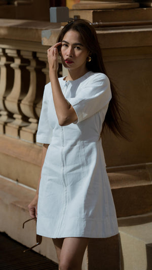 white denim mini dress with front zip and short sleeves