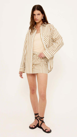 Model showcasing the Zahara Cotton Stripe Mini Skirt paired with a matching shirt in a summer outfit.