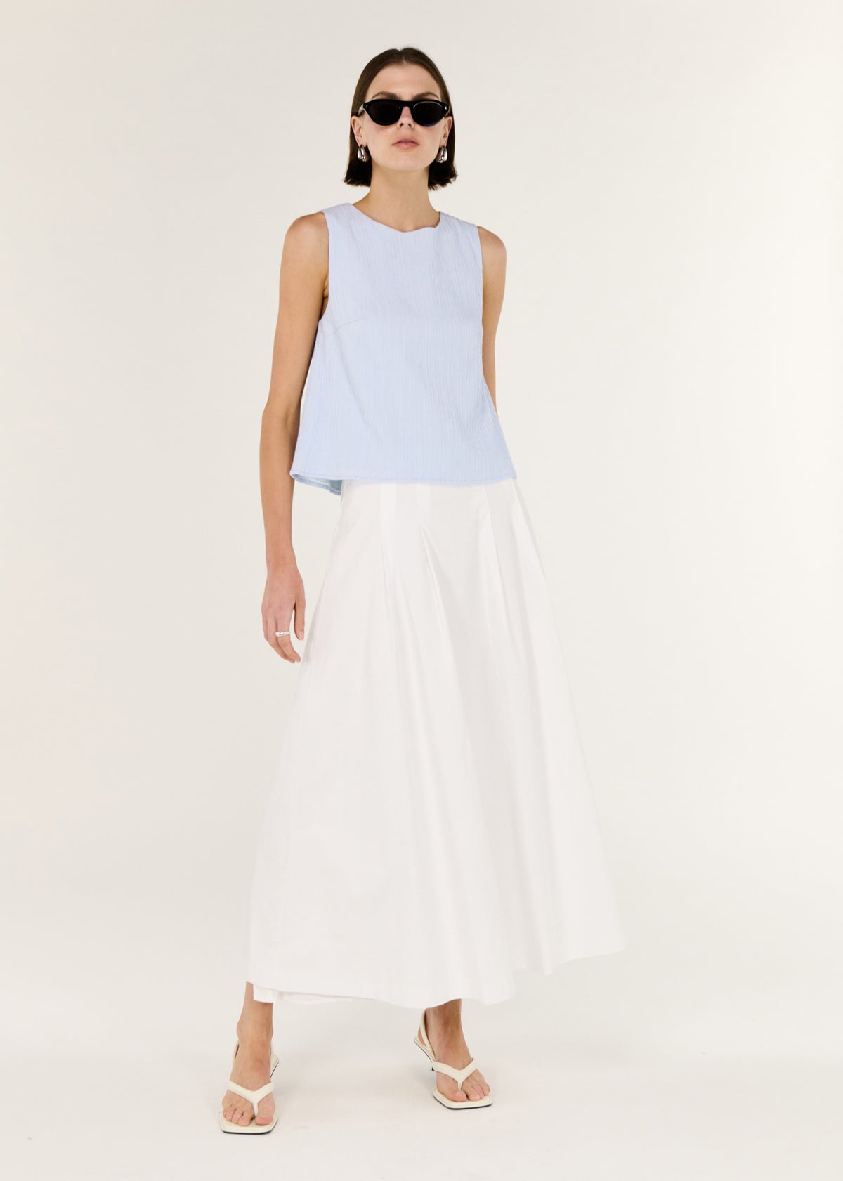 Model wearing A-Line White Cotton Maxi Skirt with a mid-rise waist fit and a maxi length silhouette.