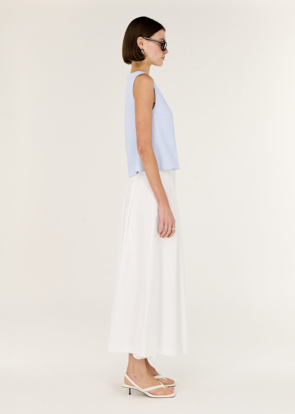 Side view of the A-Line White Cotton Maxi Skirt, showing a lightweight and breathable fabrication.