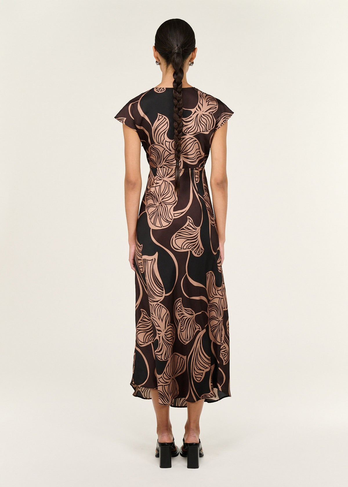 Back view of the Abstract Leaf Print Bias Cut Midi Dress with a soft V neckline and a cap sleeve detail.