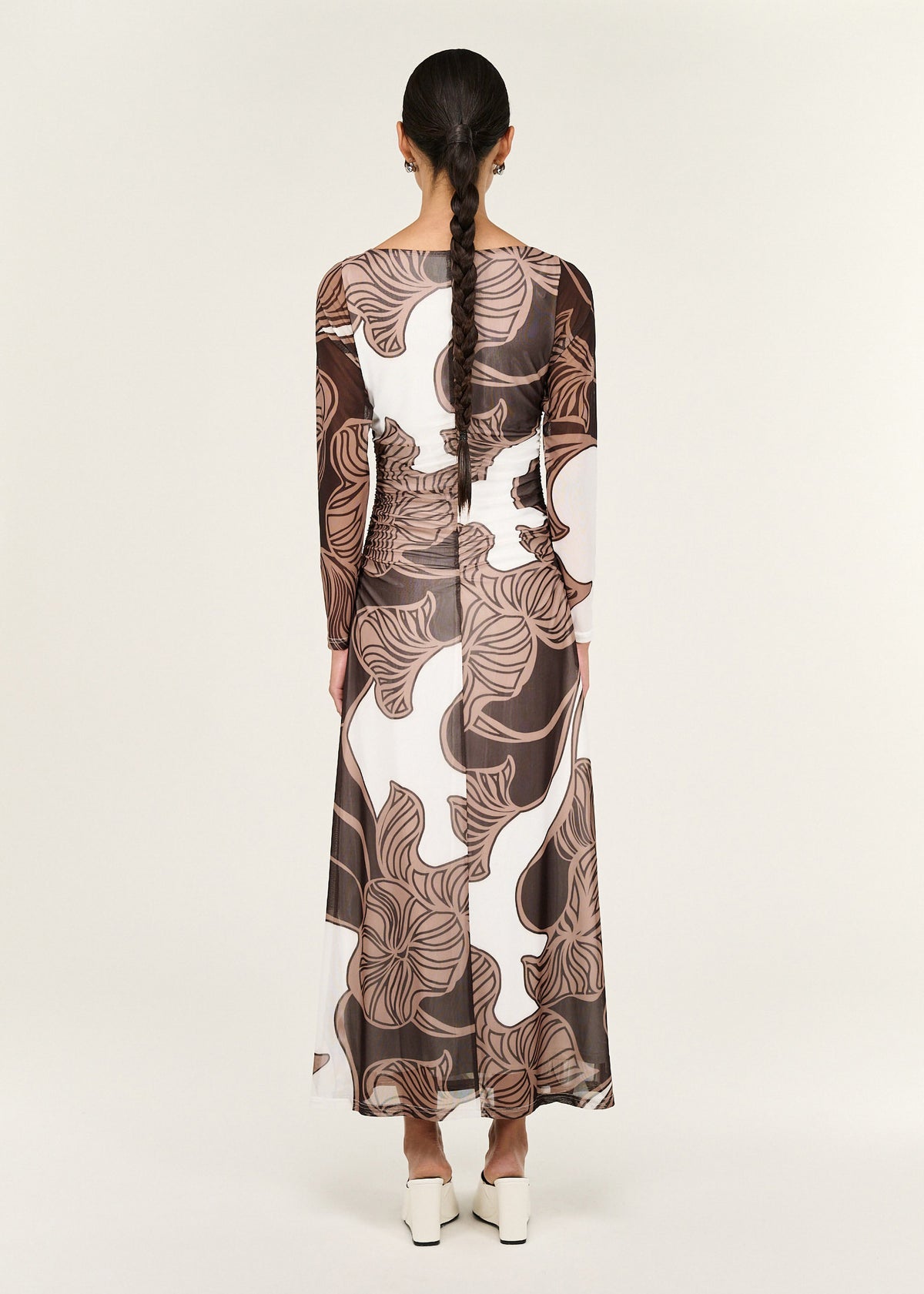 Back view of the Abstract Leaf Print Mesh Midi Dress with long sleeves and a sheer mesh fabrication with stretch.