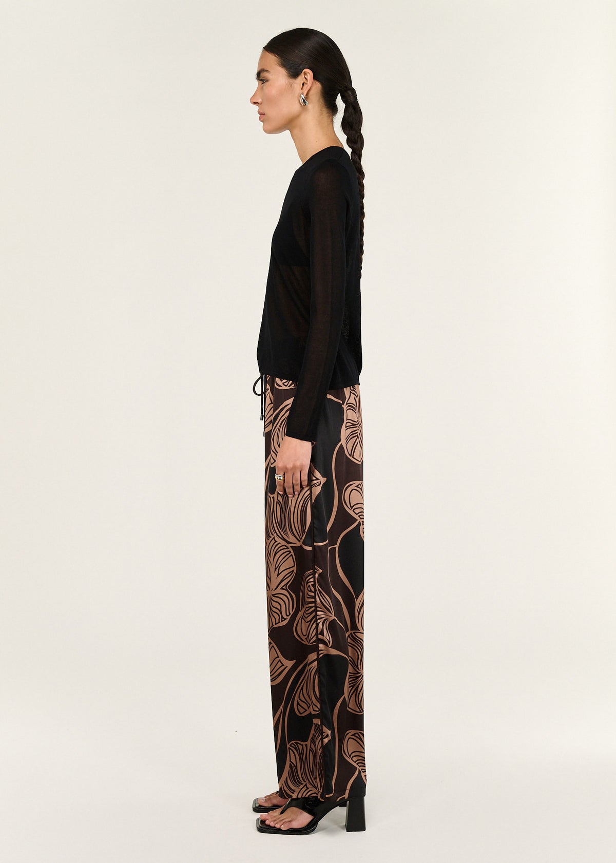 Side view of the Abstract Leaf Print Relaxed Silky Pants, showing an elasticated waistband with drawstring and a full-length silhouette.