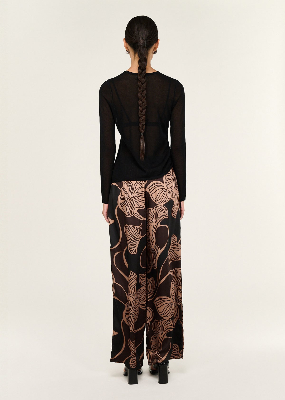 Back view of the Abstract Leaf Print Relaxed Silky Pants with an elasticated waistband with drawstring and a full-length silhouette.