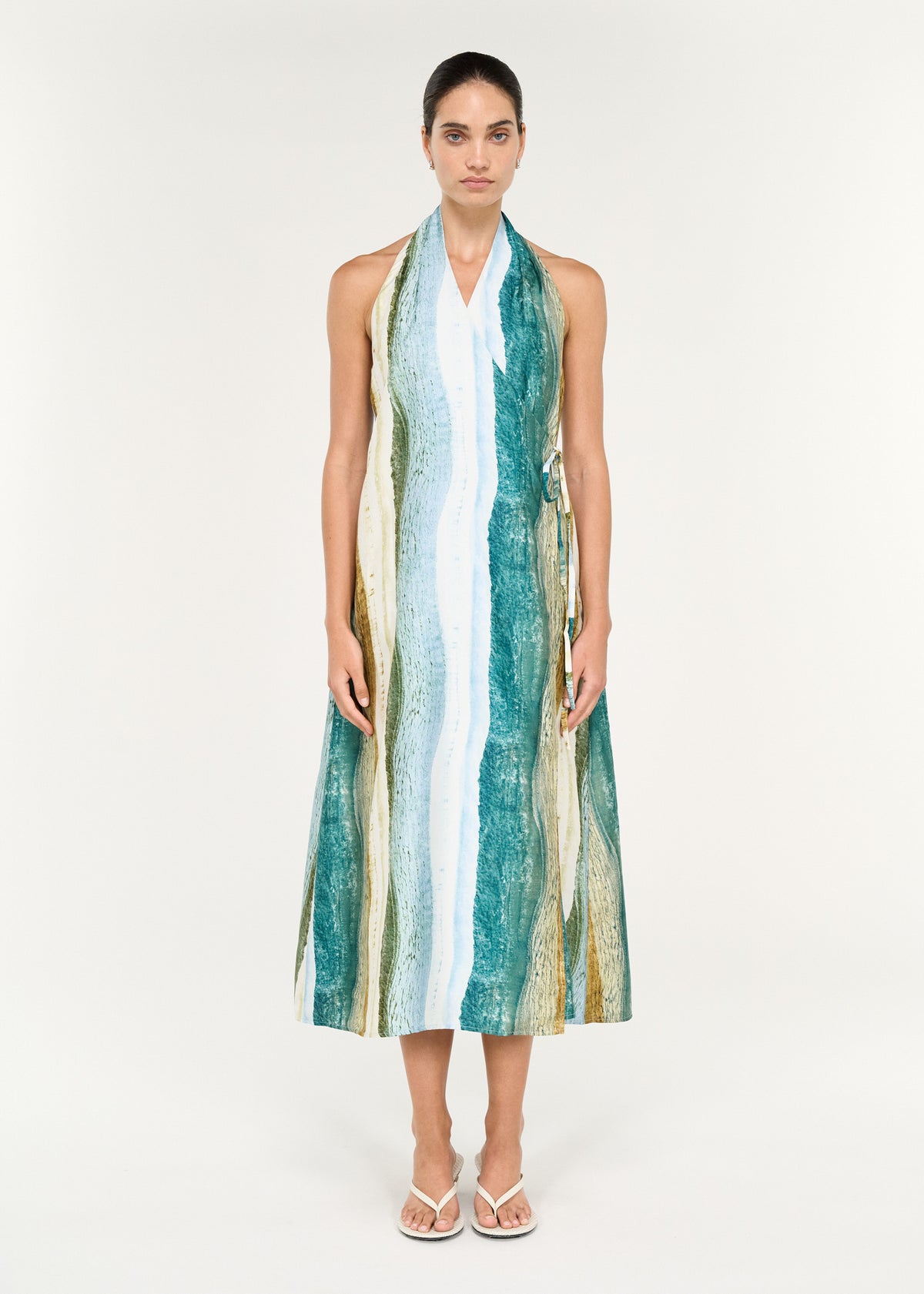 Wrap Halter Midi Dress in Ocean Tide featuring a coastal-inspired print and a flowing silhouette.