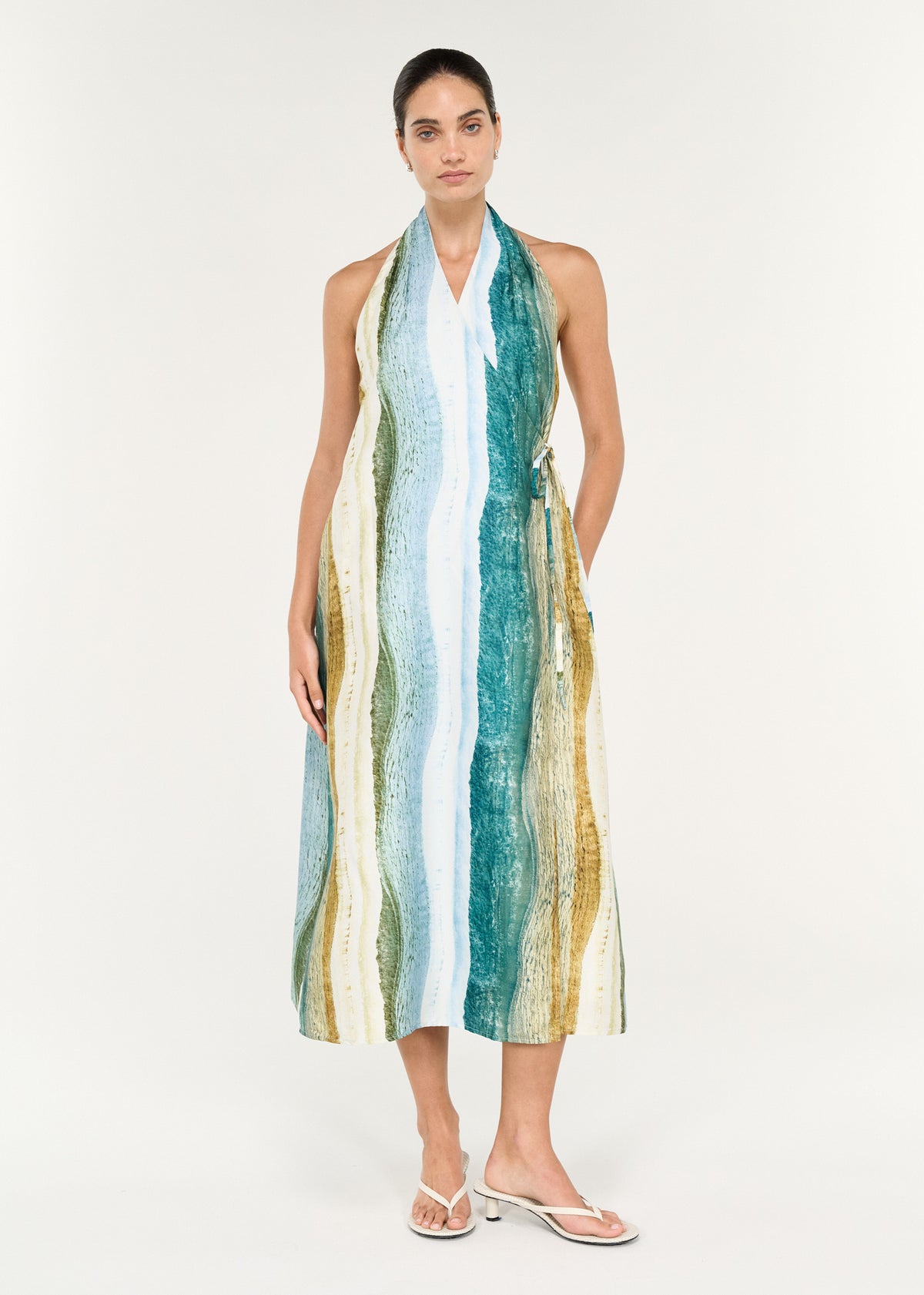 Wrap Halter Midi Dress in Ocean Tide worn by a model, featuring a coastal-inspired print and a flattering halter neckline.
