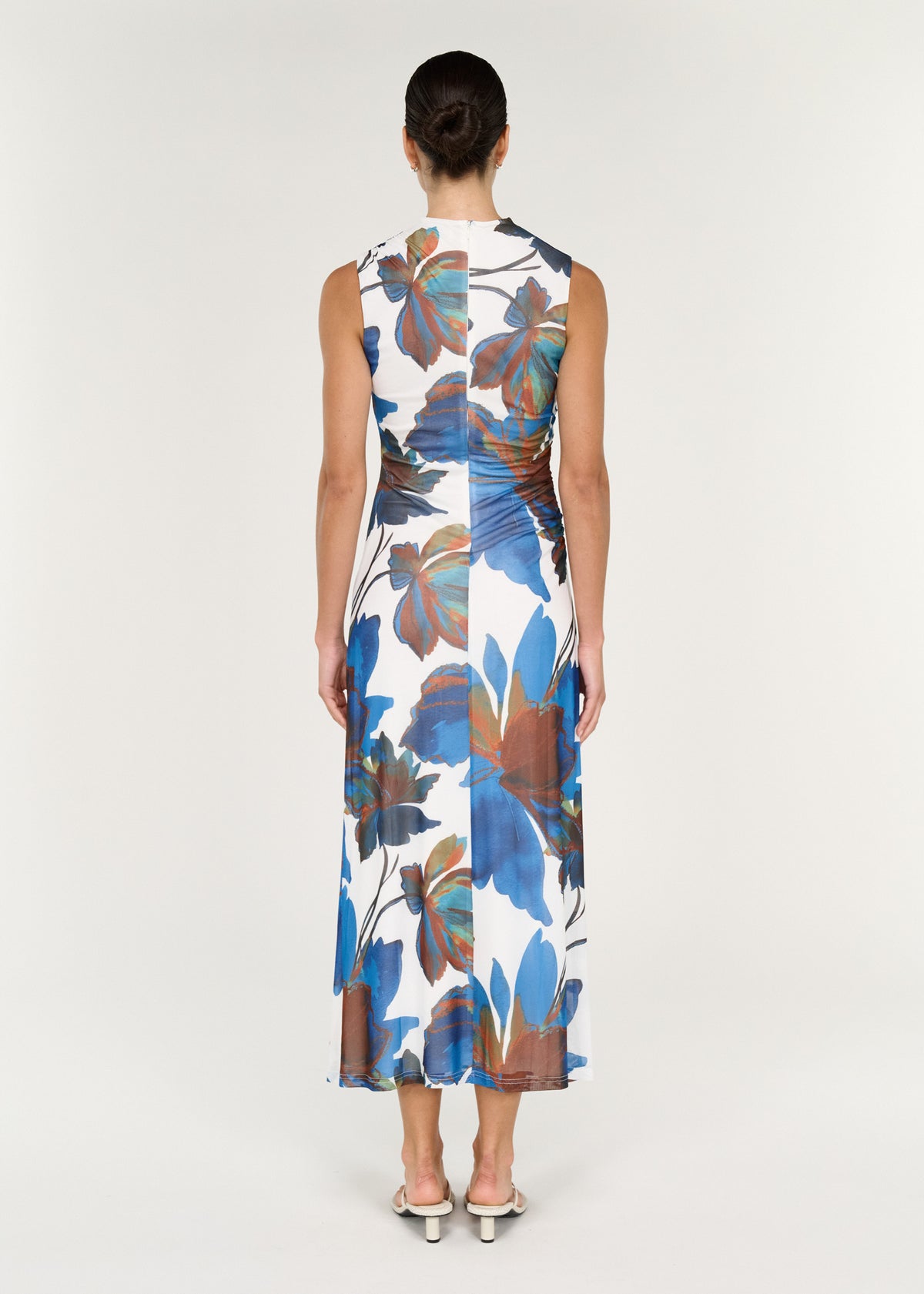 Back view of a Sleeveless Mesh Midi Dress in Cobalt Floral featuring vibrant floral print and a sleek design.