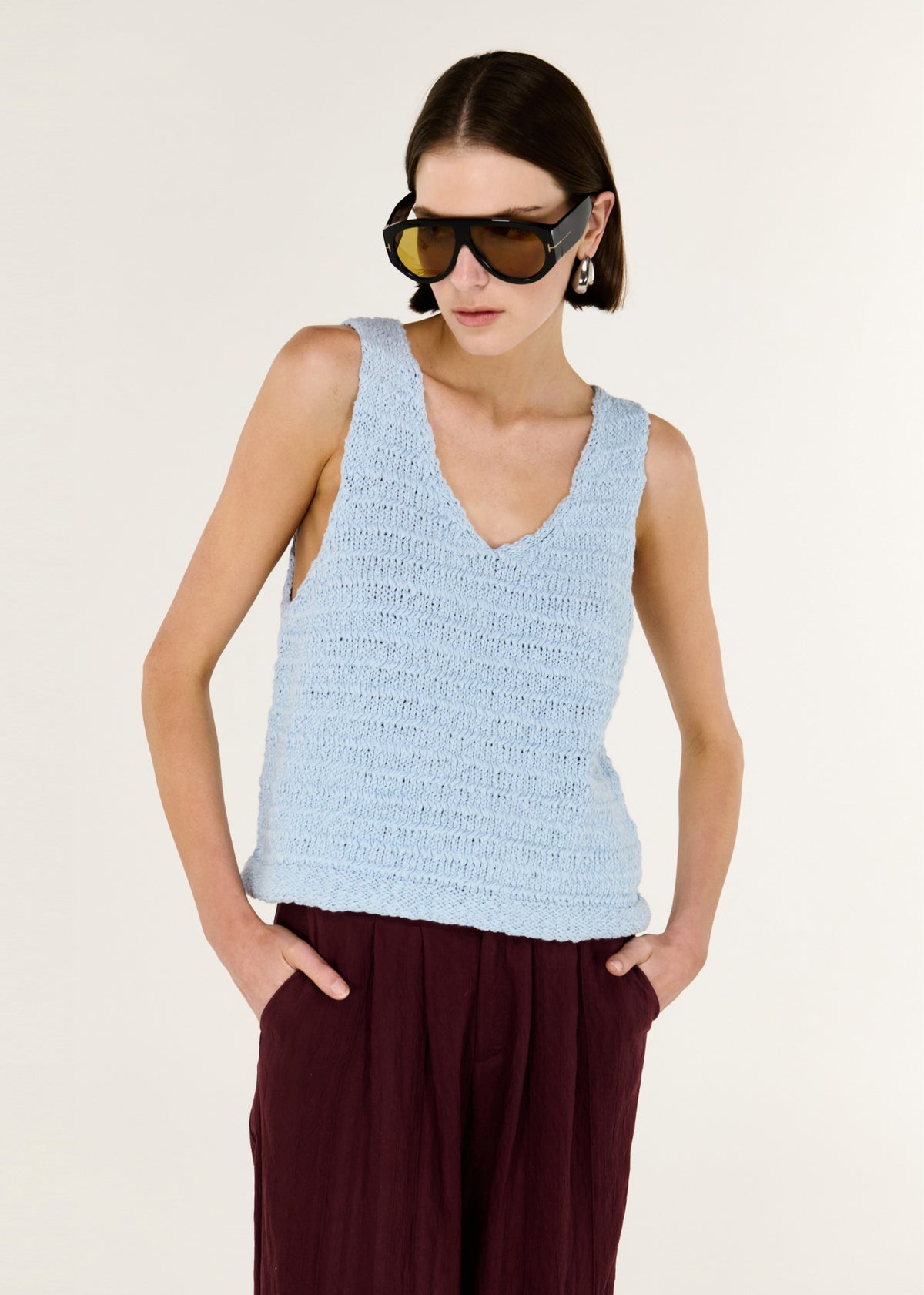 Close-up of the Baby Blue Cotton Knit Tank, showing a sleeveless cut and a flattering V neckline.