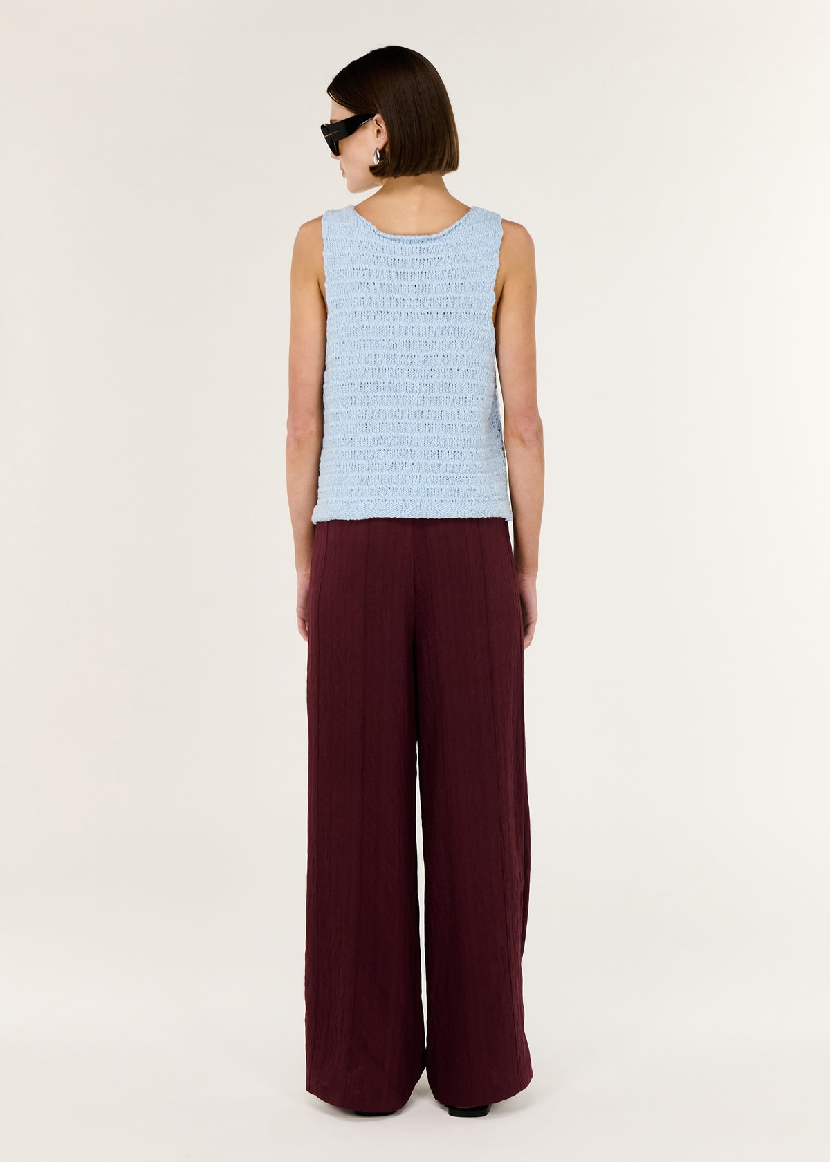 Back view of the Baby Blue Cotton Knit Tank with a sleeveless cut and a flattering V neckline.
