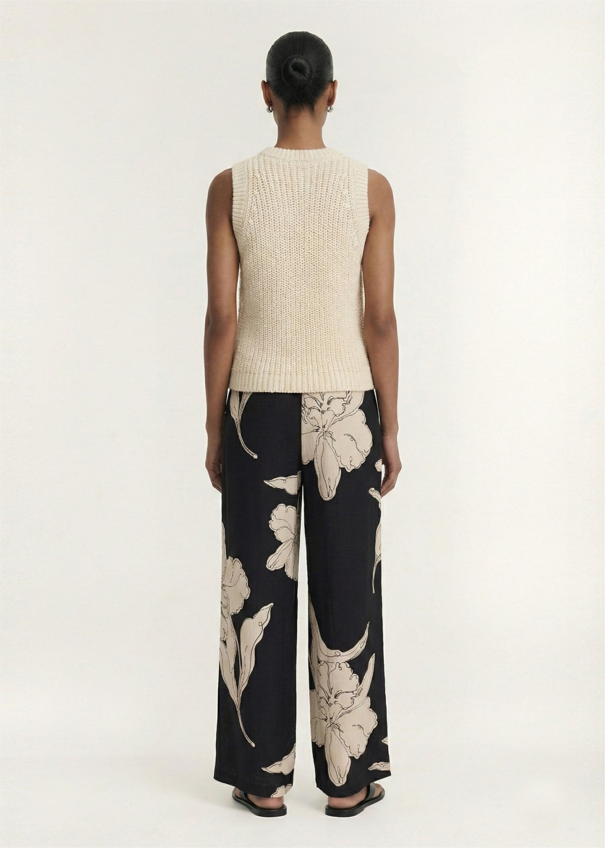 Back view of the Beige Sleeveless Knit Tank Top, showing a chunky rib knit fabrication and a sleeveless silhouette.