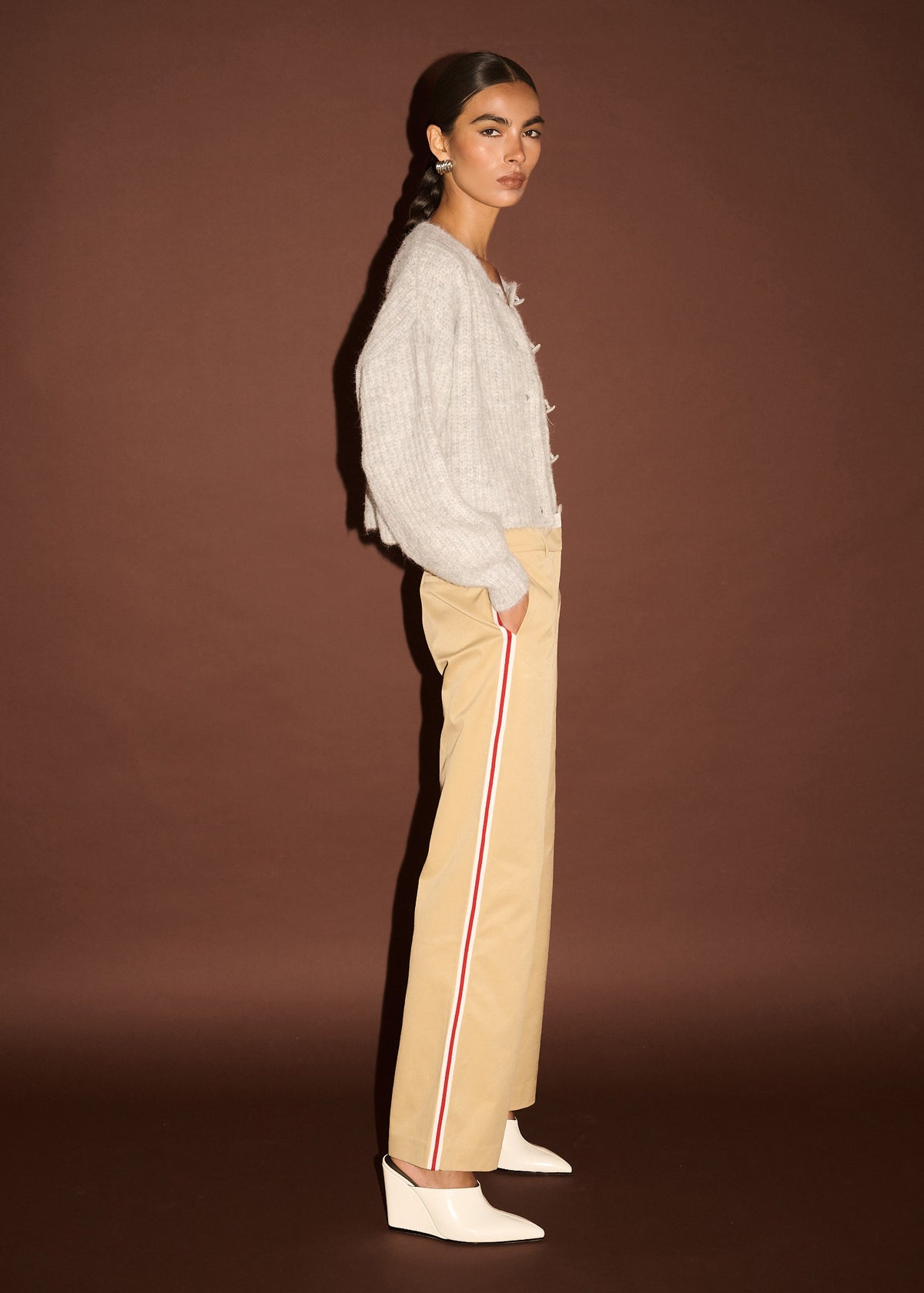 Model wearing Beige Striped Contrast Waist Pants with a mid-rise waist and a straight leg silhouette, turned to the side.