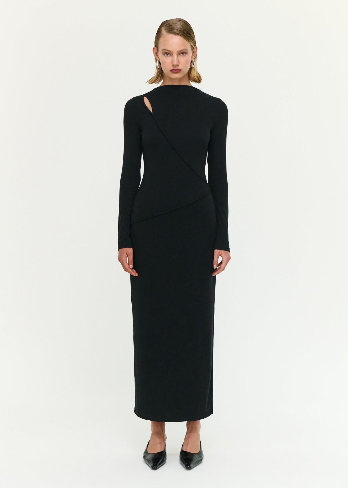 Model wearing Black Asymmetric Seam Detail Midi Dress with a soft stretch knit fabrication and a fitted silhouette.