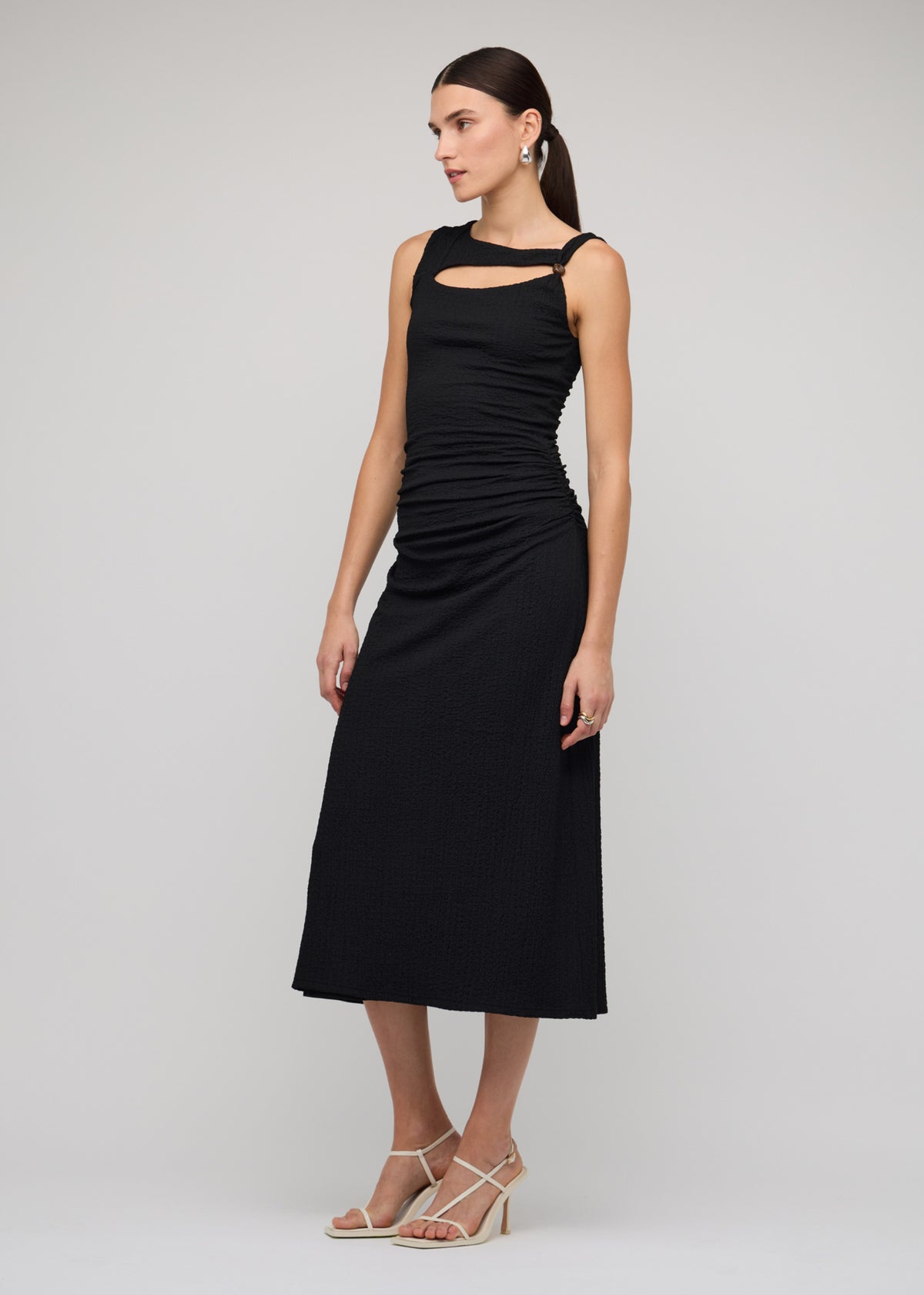 Model wearing Black Cut Out Ruched A-Line Midi Dress With Bead Detail, showing an asymmetric neckline with cut-out detail.
