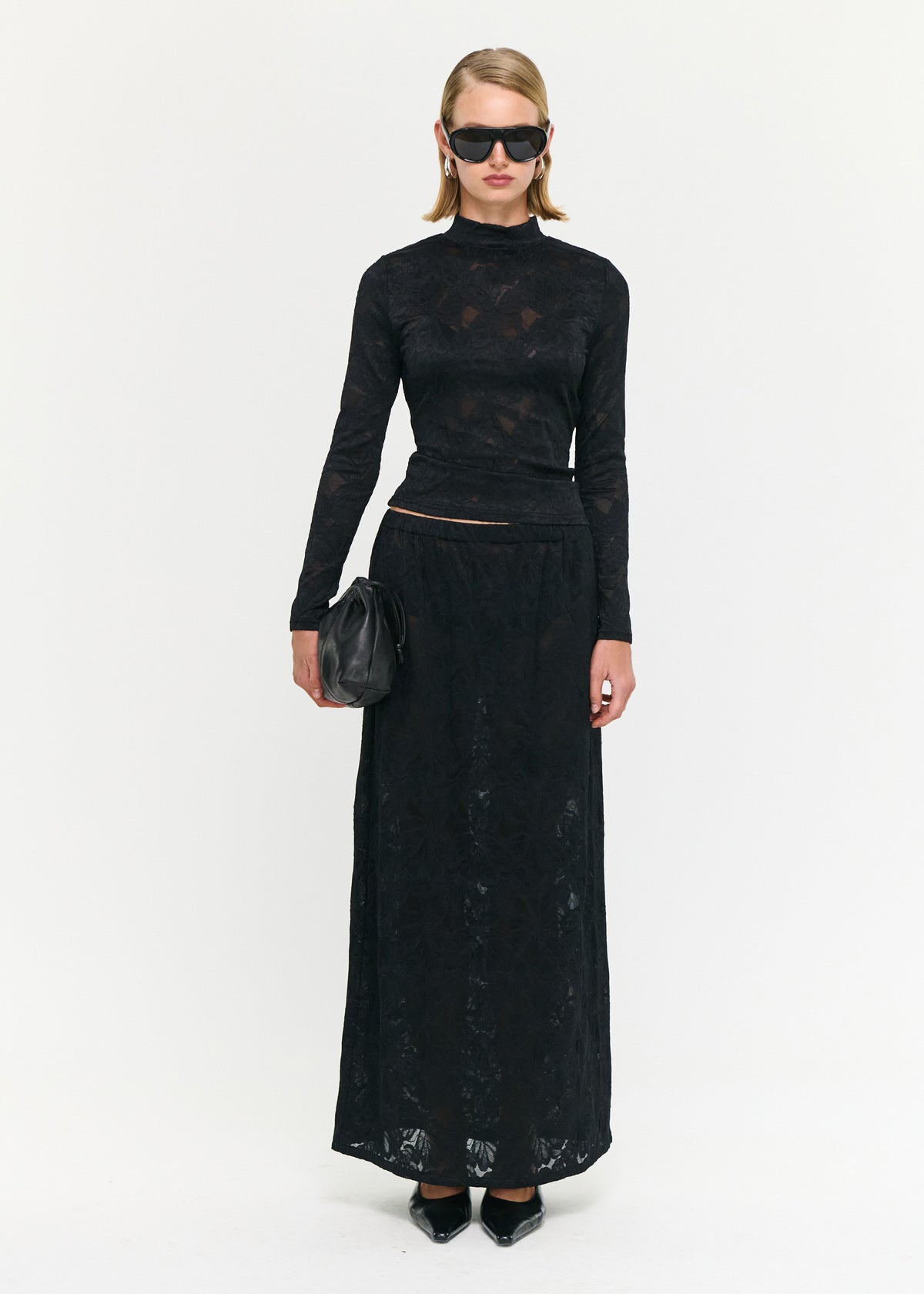 Model wearing Black Sheer Lace Long Sleeve Top, showing a lightweight, stretch feel and a designed.