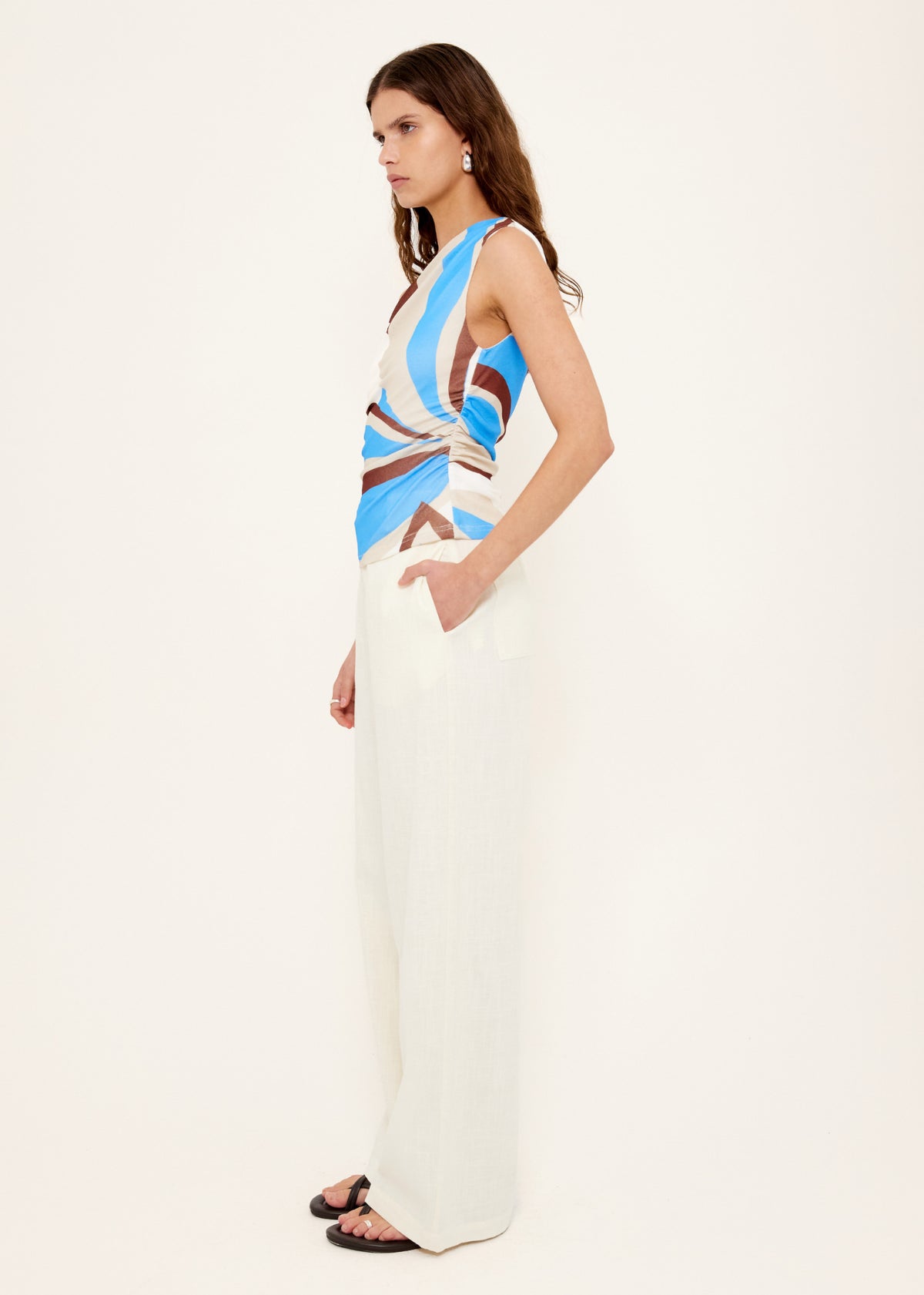 Side view of the Blue Abstract Asymmetric Mesh Top, showing an abstract print exclusive to Staple the Label and a fully lined.