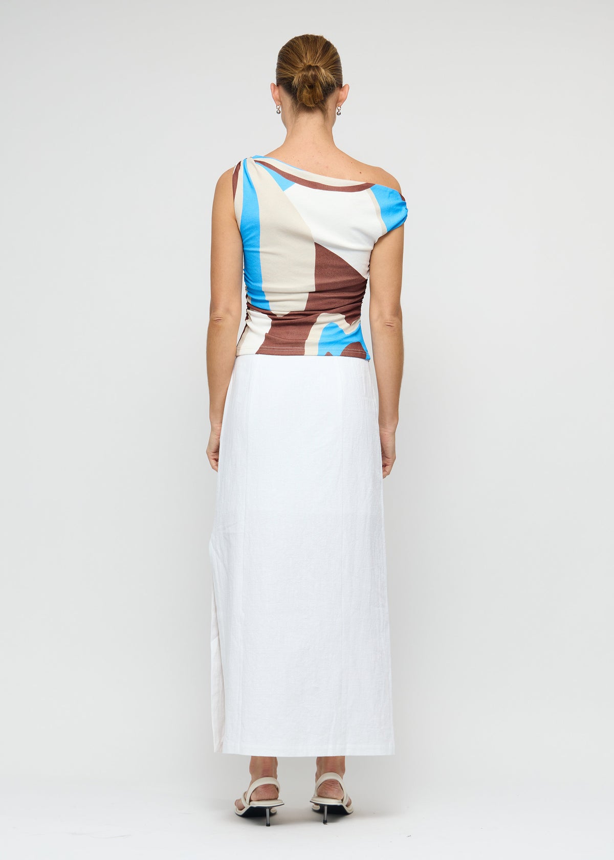 Back view of the Blue Abstract Asymmetric Mesh Top, showing a one-shoulder asymmetric neckline and a stretch mesh fabric.