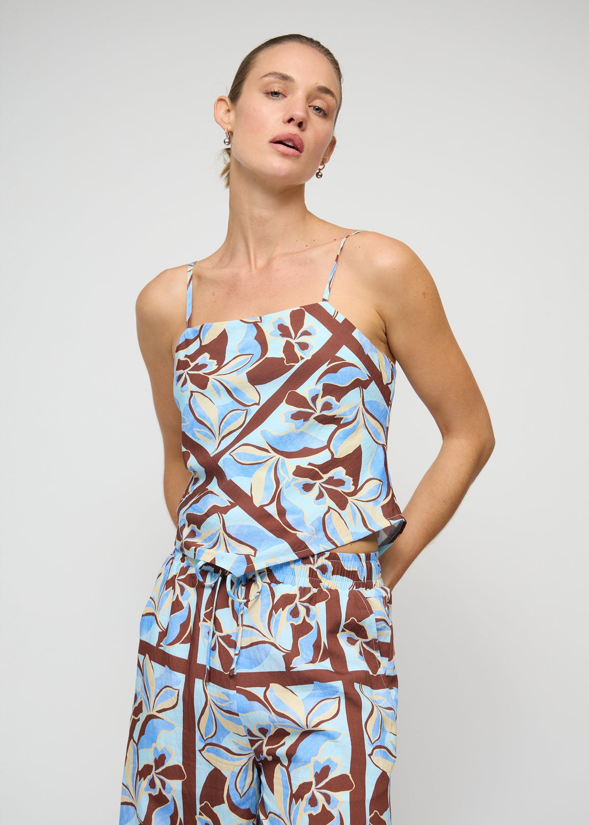 Close-up of the Blue Abstract floral Scarf Cami Top, showing a draped cowl neckline and adjustable spaghetti straps.