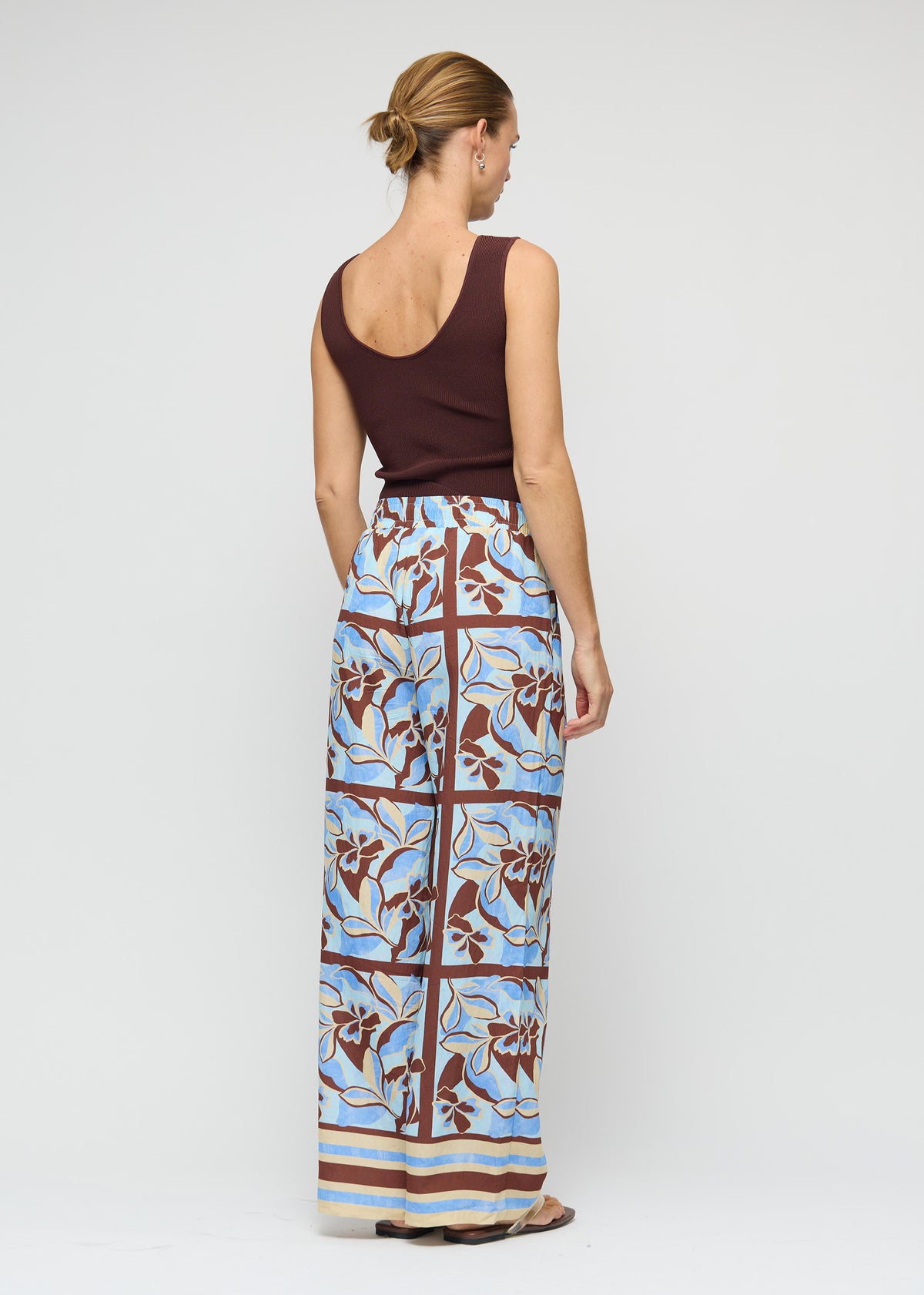 Back view of the Blue Abstract floral Wide-Leg Drawstring Pants with a full-length wide leg silhouette.