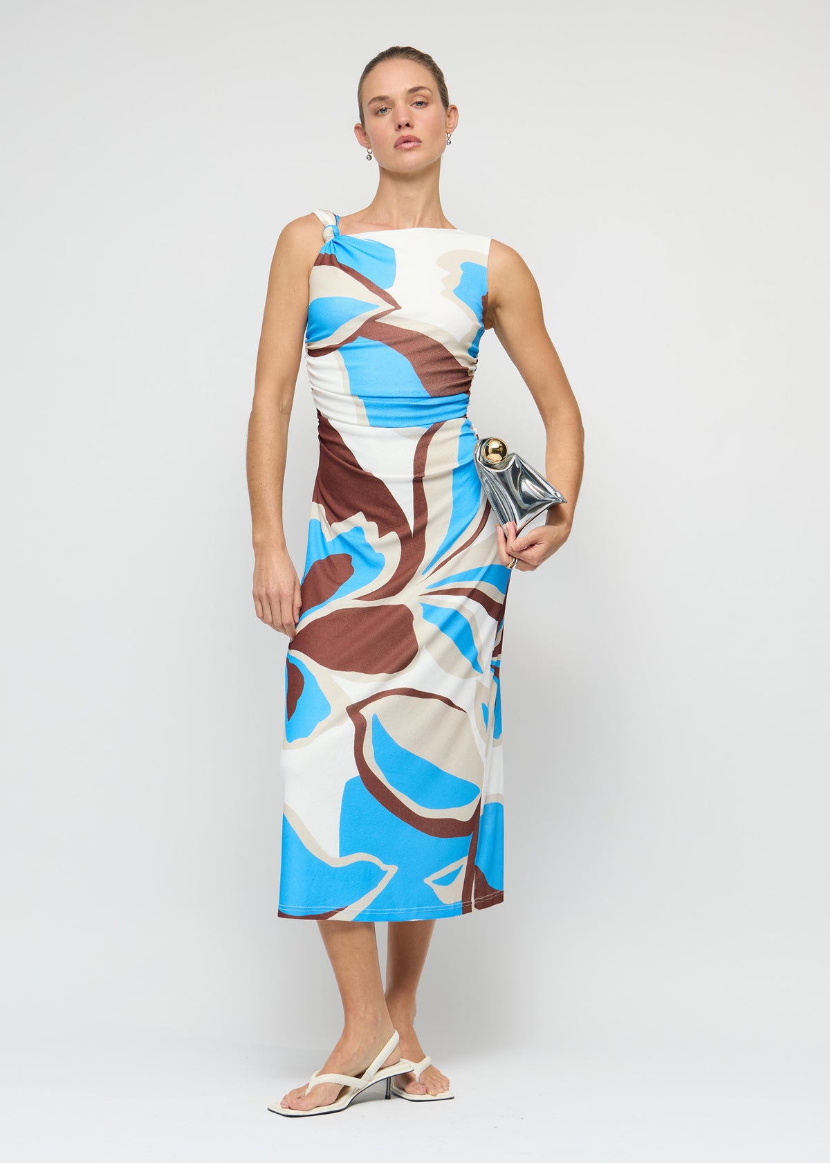 Model wearing Blue Abstract Mesh Midi Dress with a one-shoulder neckline with knot detail and a midi length with flattering side ruching.