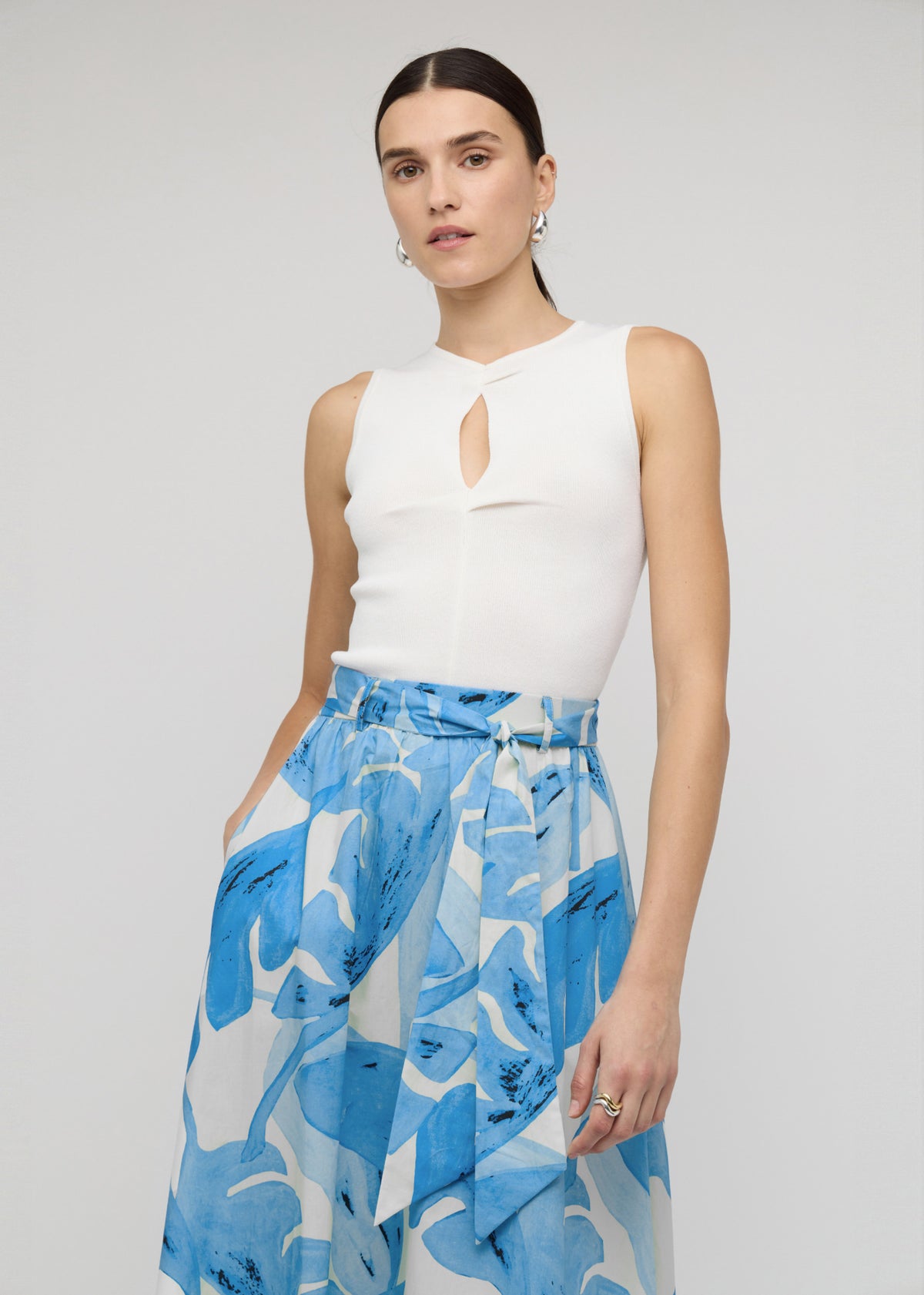 Close-up of the Blue and White Floral Cotton A-Line Maxi Skirt, showing an adjustable self-tie belt at waist.