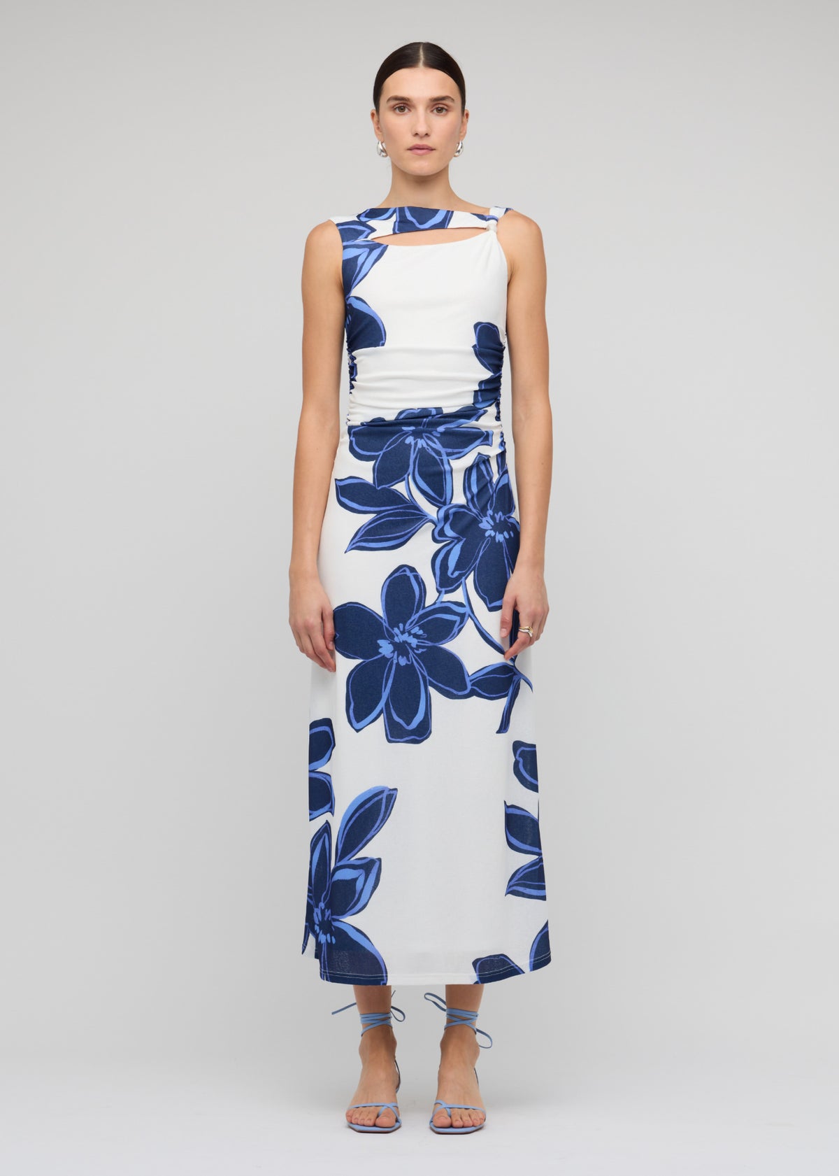 Model wearing Blue and White Floral Mesh Midi Dress with a blue oversized floral print and a midi length, body-skimming silhouette.