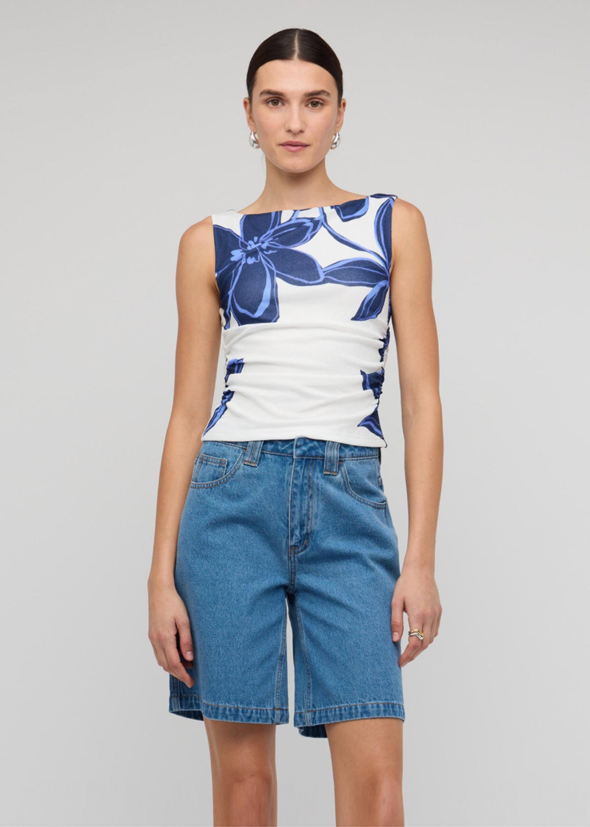 Close-up of the Blue and White Floral Mesh Top, showing a blue floral mesh print and a sleeveless tank silhouette.