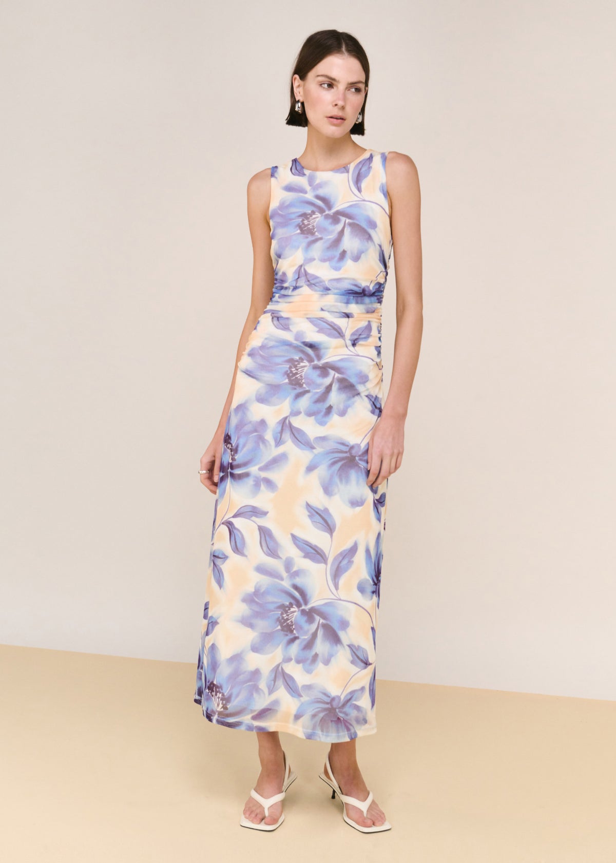 Model wearing Blue Blurred Floral Mesh Midi Dress, showing a stretch mesh fabrication and a soft blurred floral print.