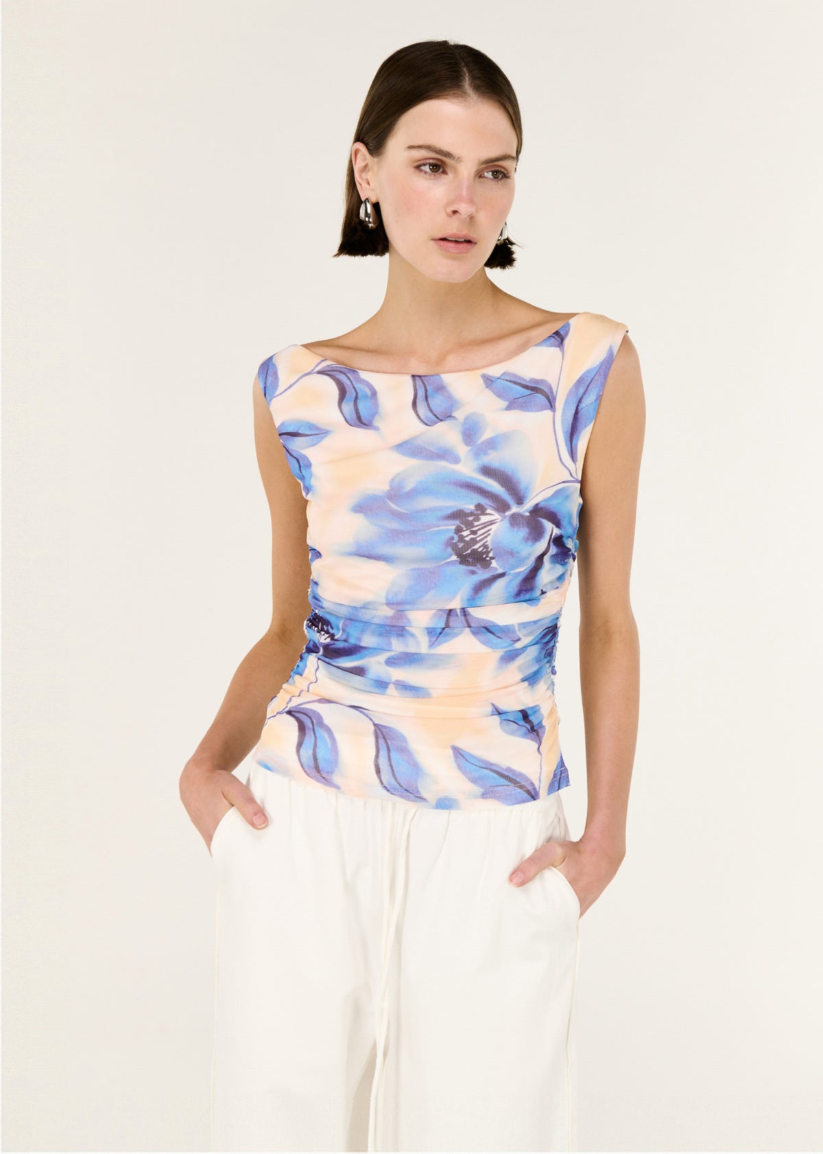 Close-up of the Blue Blurred Floral Mesh Top, showing a sleeveless cut and a stretch fabrication.