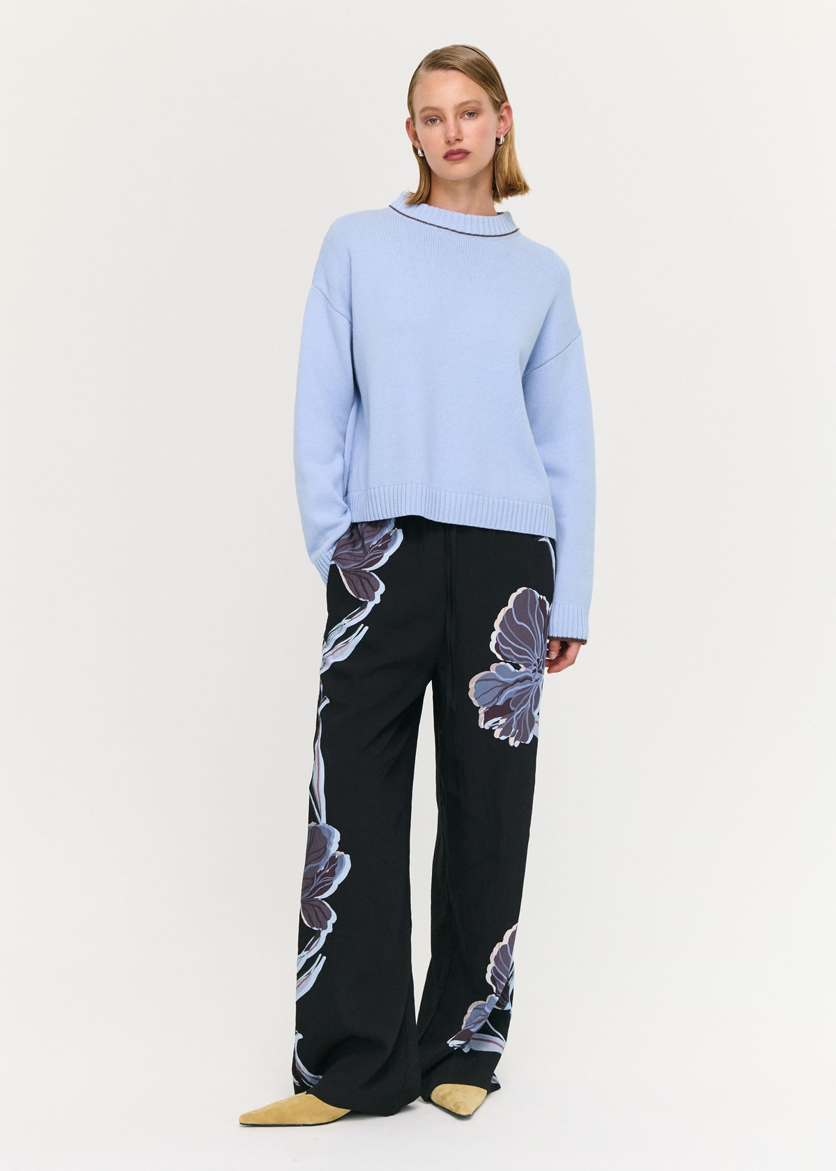 Model wearing Blue Cotton Blend Contrast Seam Jumper, showing a soft knit fabrication and a relaxed fit silhouette.