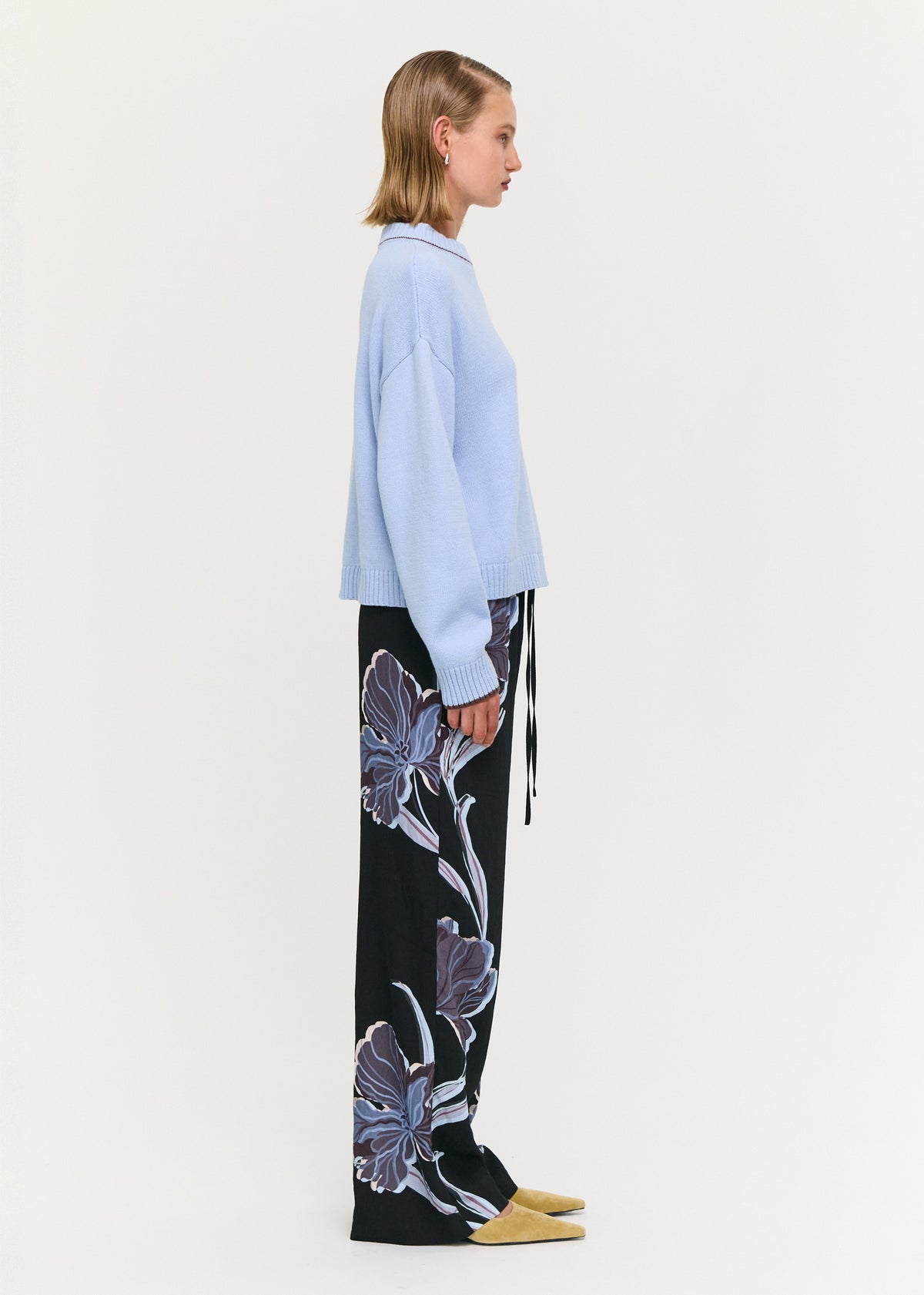 Side view of the Blue Cotton Blend Contrast Seam Jumper, showing a crew neckline with contrast trim and long sleeves with ribbed cuffs.
