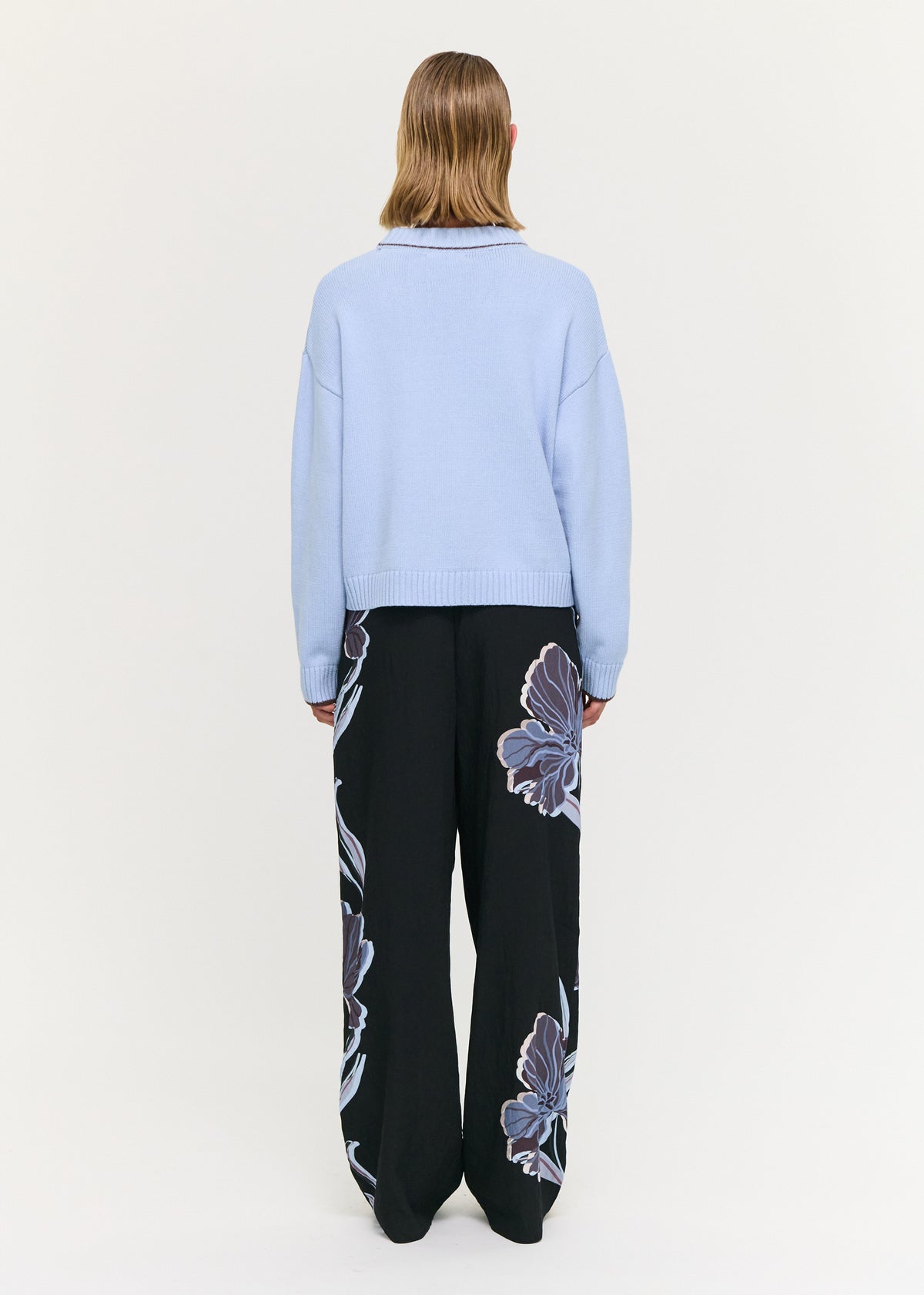 Back view of the Blue Cotton Blend Contrast Seam Jumper with a soft knit fabrication and a relaxed fit silhouette.