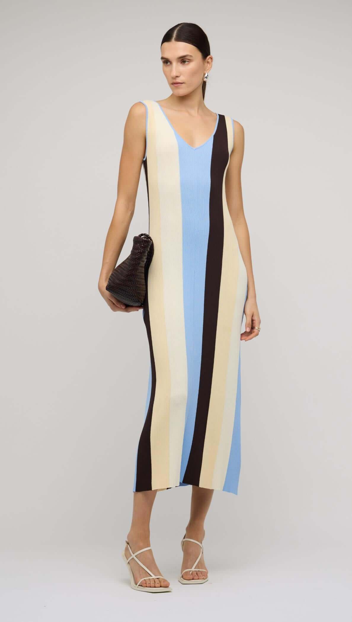 Blue & Cream Stripe Knit Midi Dress showcased by a model, featuring bold stripes in blue, cream, and chocolate tones.