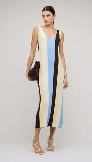 Blue & Cream Stripe Knit Midi Dress showcased by a model, featuring bold stripes in blue, cream, and chocolate tones.