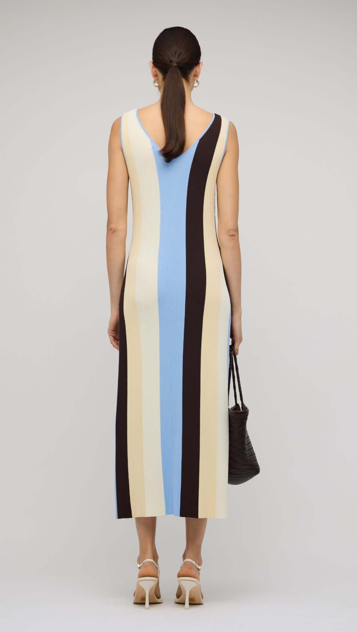 Blue & Cream Stripe Knit Midi Dress showcasing the back view with bold stripes in blue, cream, and chocolate tones.