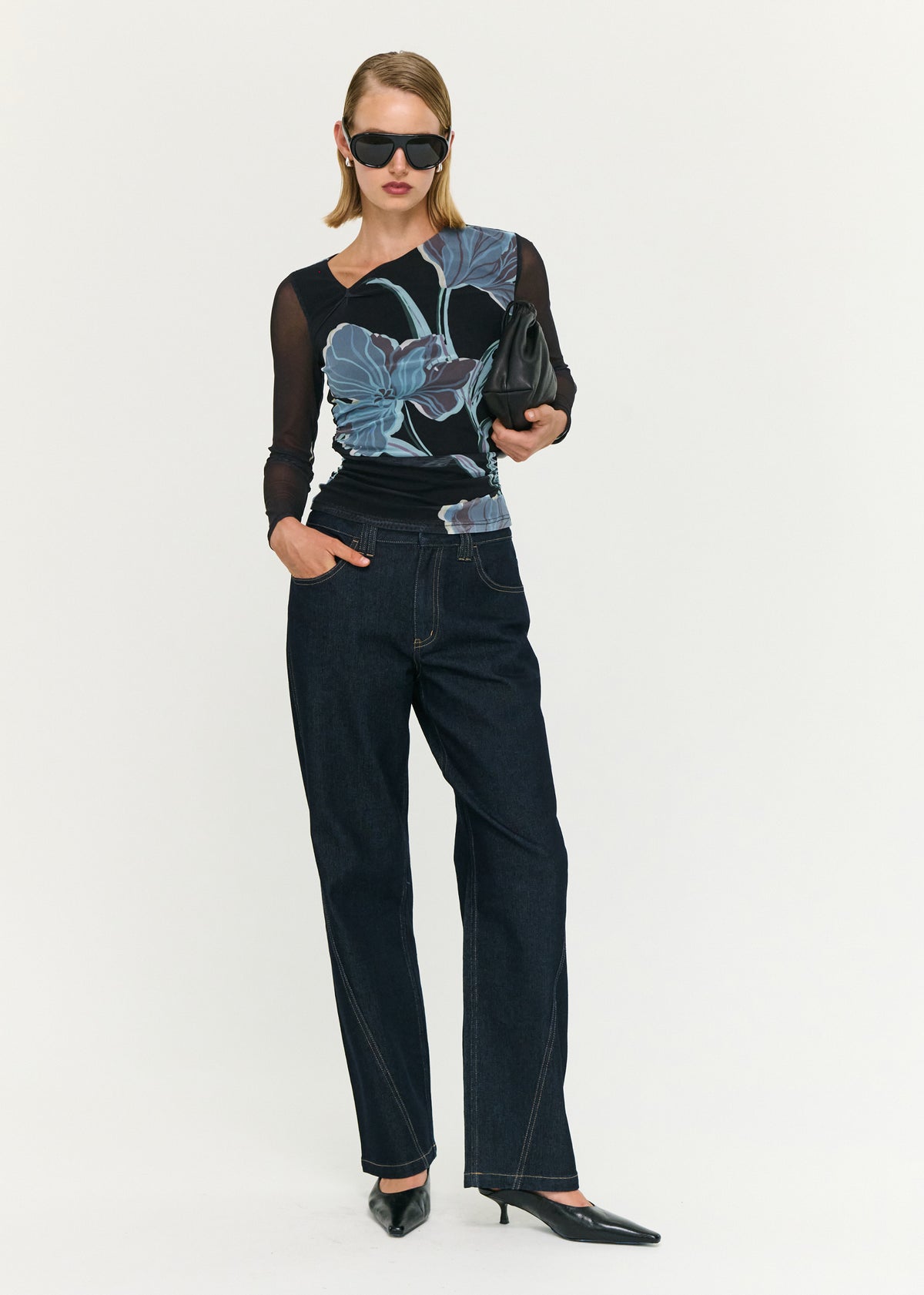 Model wearing Blue Floral Asymmetric Neck Mesh Top, showing a midnight floral print and a sheer mesh fabrication.