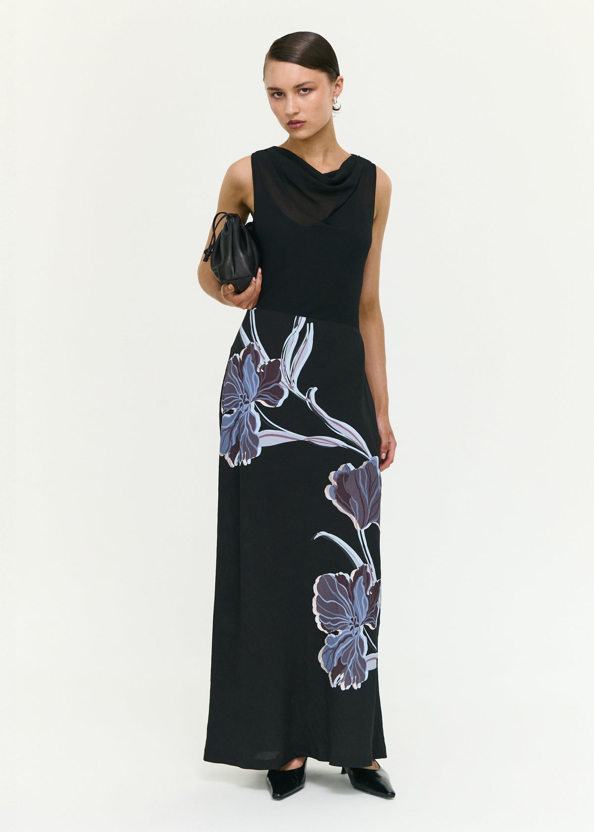 Model wearing Blue Floral Bias Cut Combo Midi Dress with a sleeveless cut and a soft draped neckline.