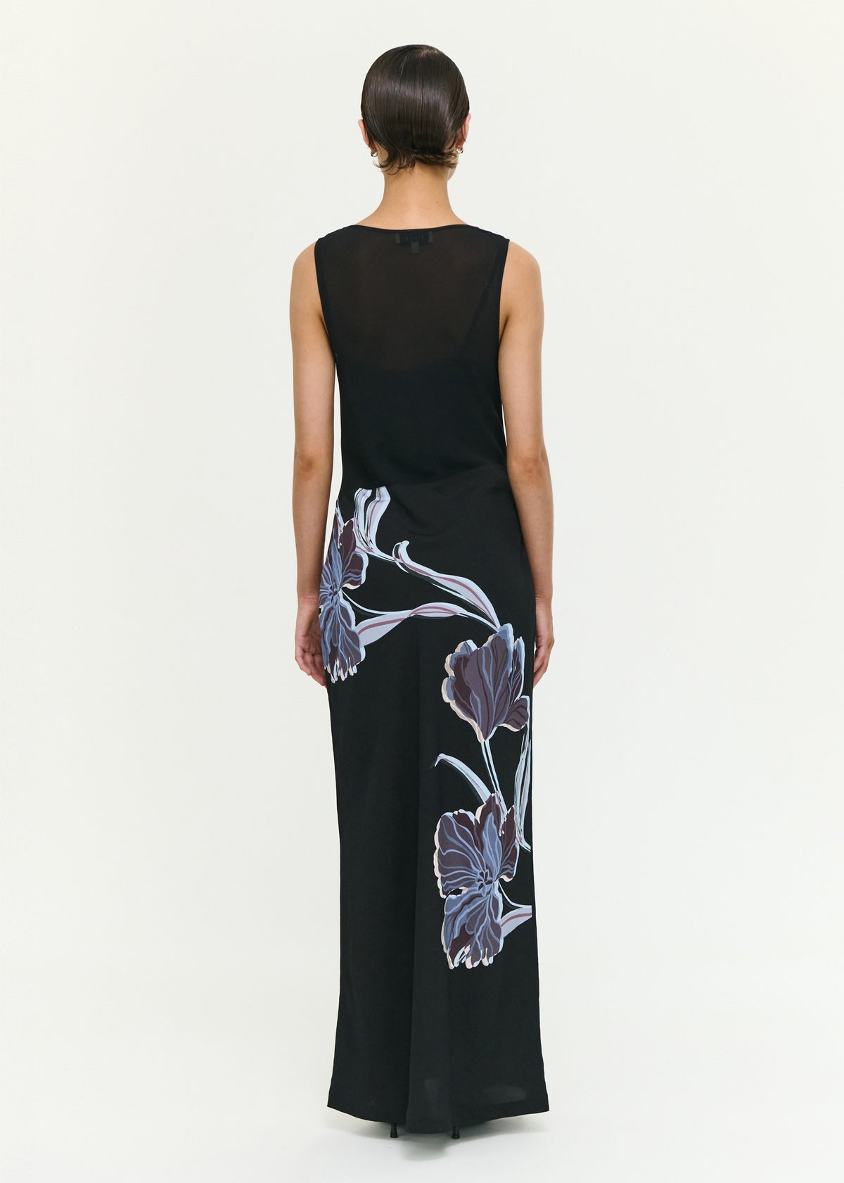Back view of the Blue Floral Bias Cut Combo Midi Dress with a lightweight woven fabrication and a sleeveless cut.