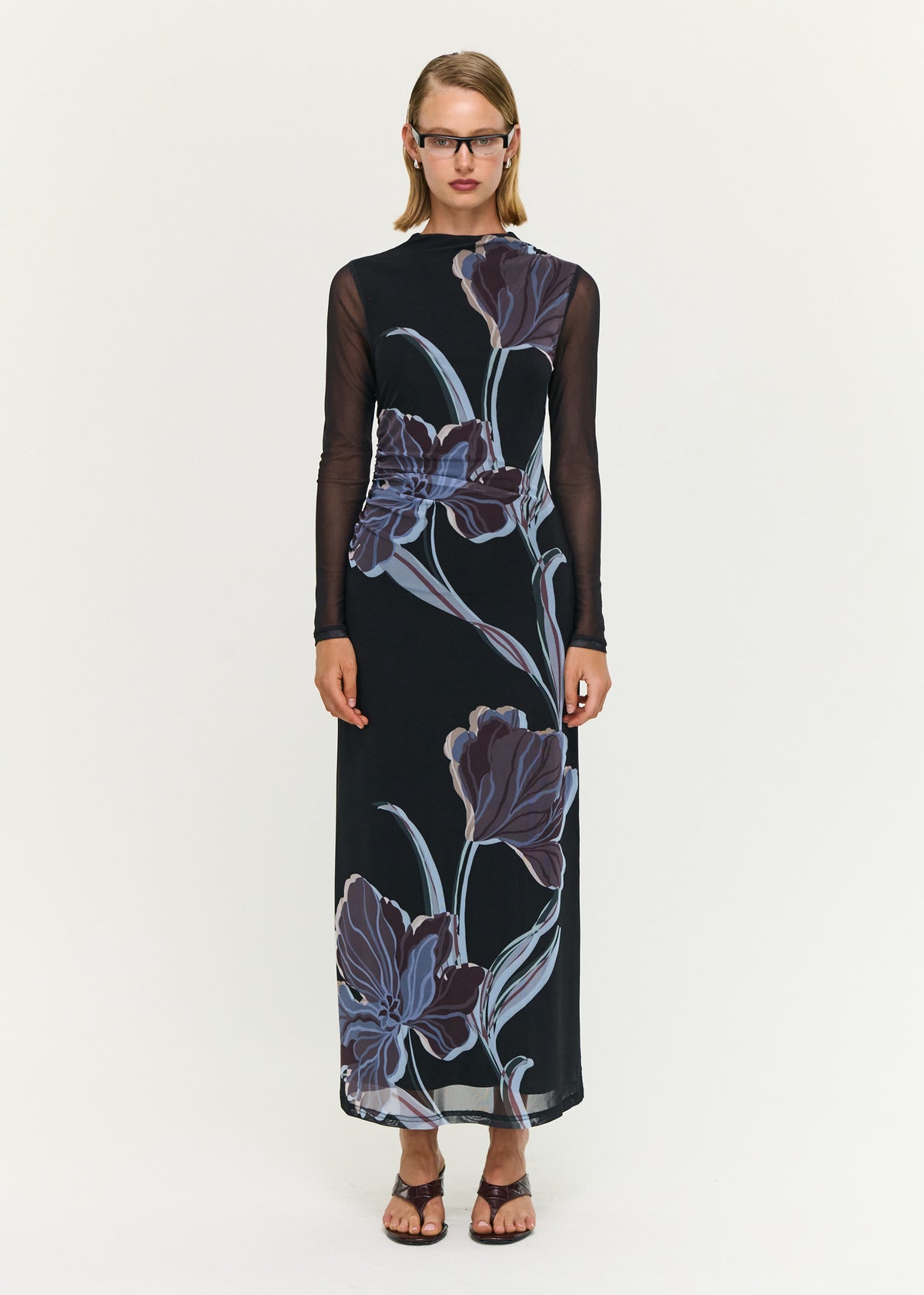 Model wearing Blue Floral Mesh Midi Dress with a sheer mesh fabrication and a fitted silhouette.